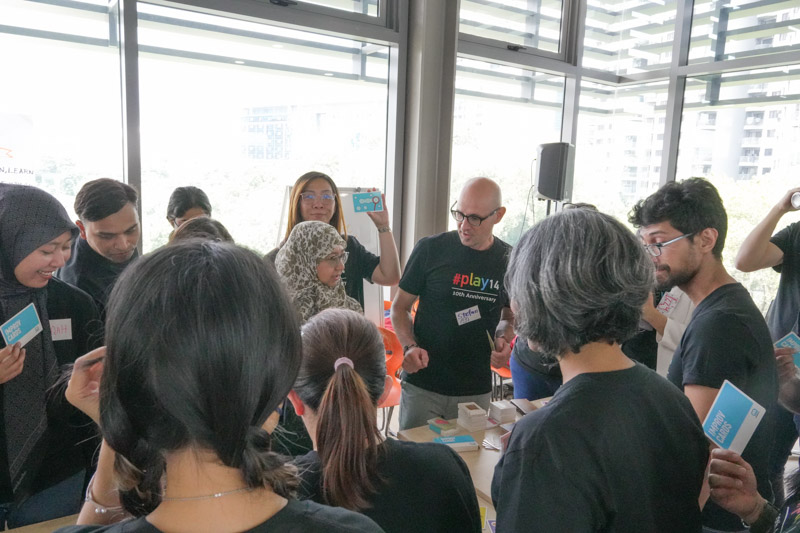 Stefan is in the middle of people holding a workshop